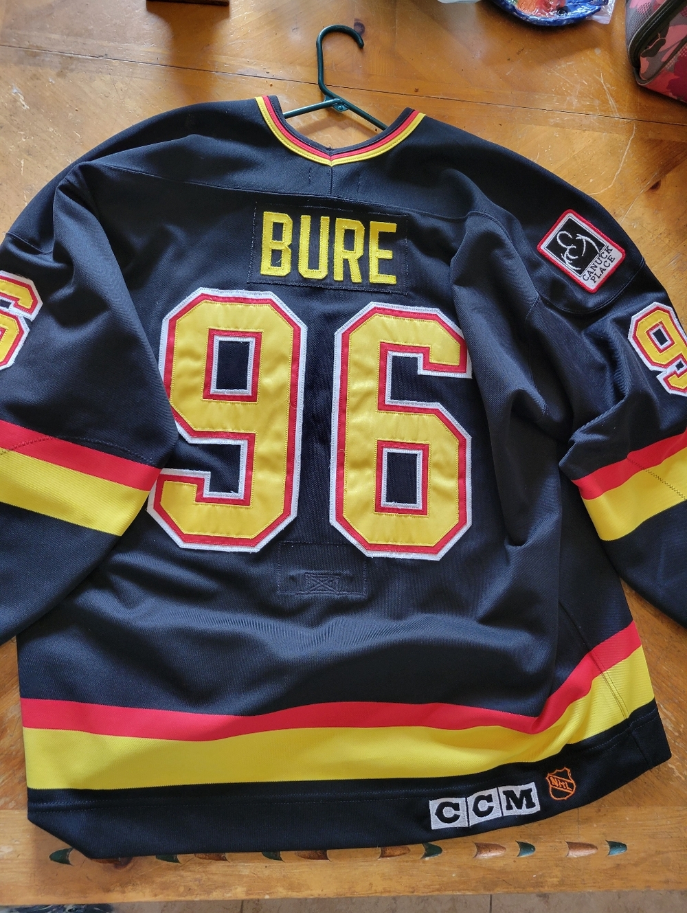 CCM Black Hockey Jersey with Yellow & Red Striping, #96 BURE